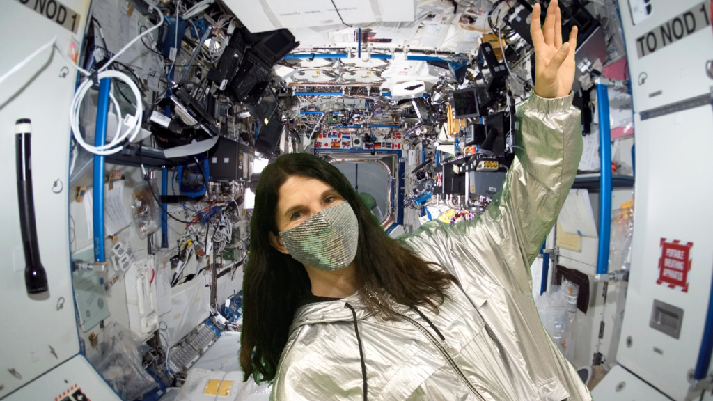 Mrs. Nordengren pretending to float in a space station in a green screen photo