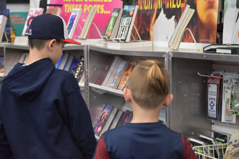 Students browse the shelves of the book fair during Bengals Night.