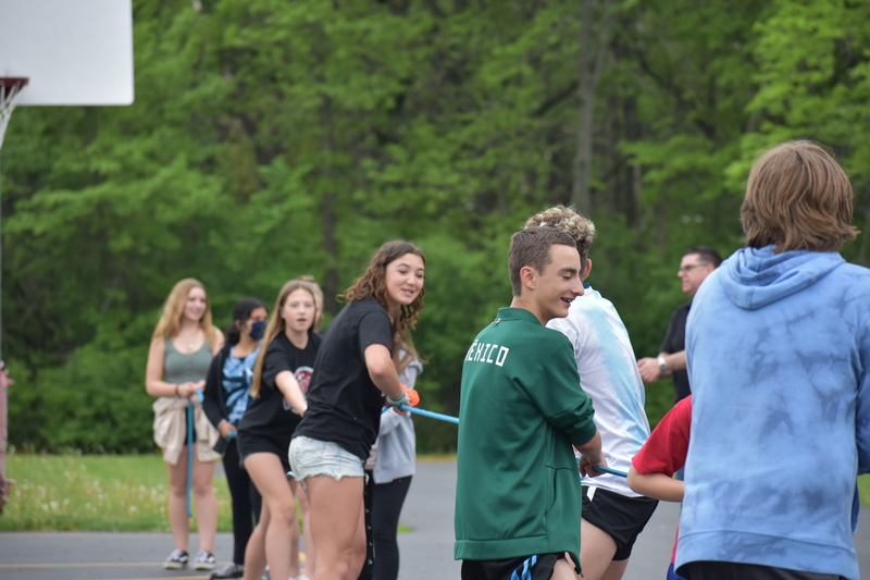 7th graders play tug-of-war on the blacktop behind Benjamin Middle School during Charity Fest.